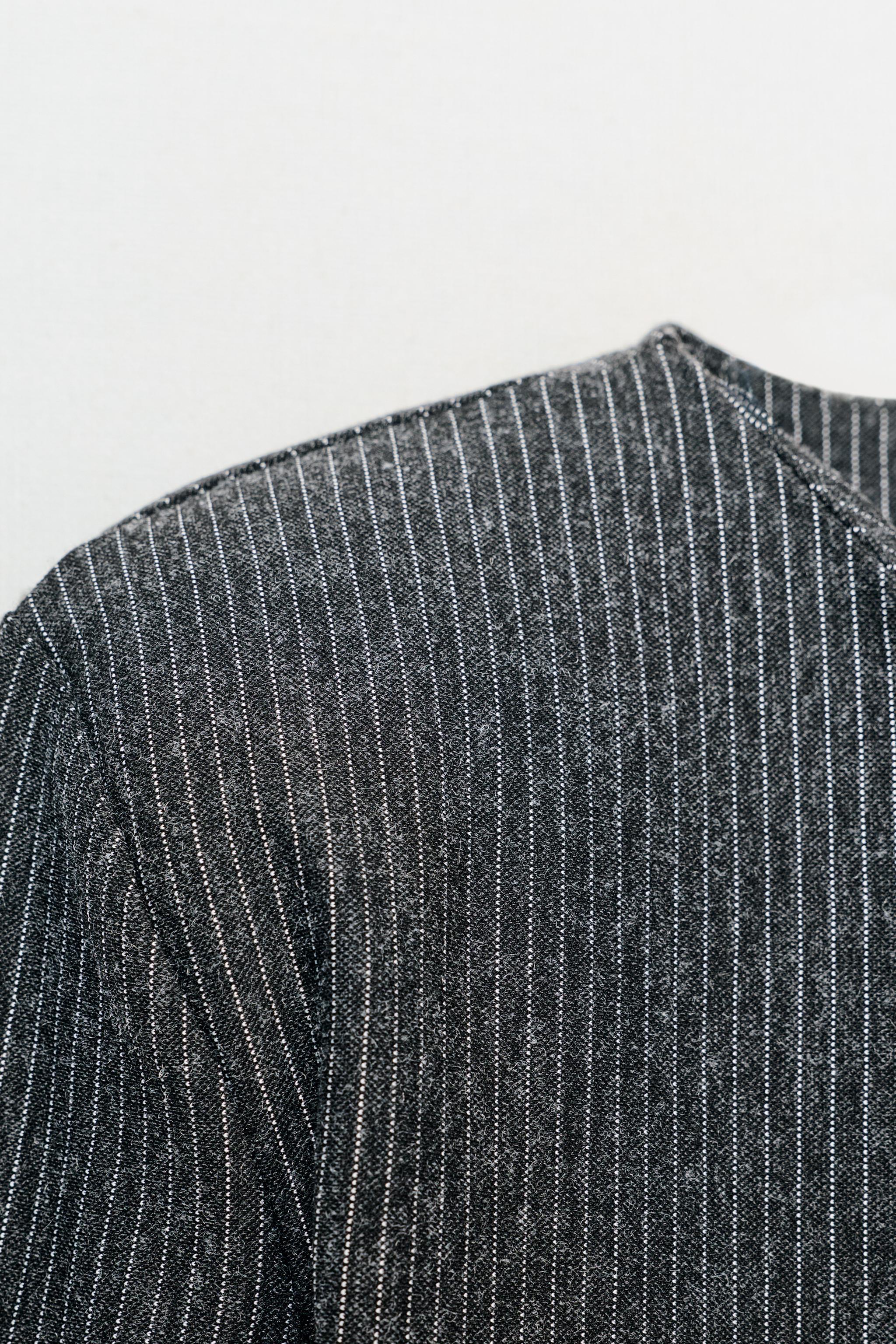 PINSTRIPED SHOULDER PAD TOP